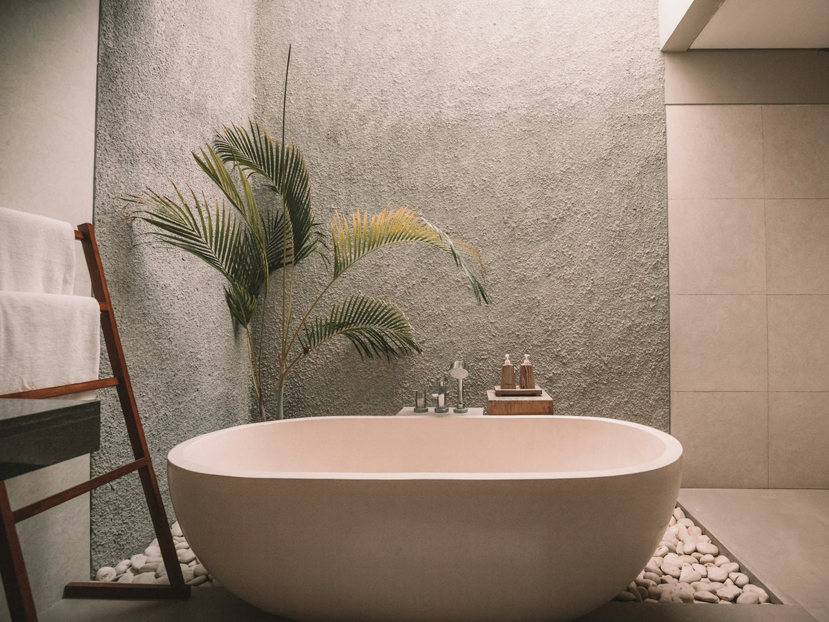 Bathroom with a freestanding soaking tub and skylight