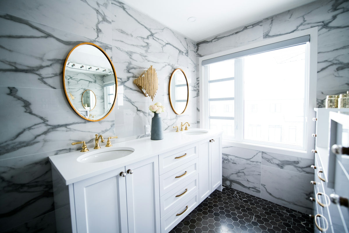 Bathroom with two sinks and a large mirror