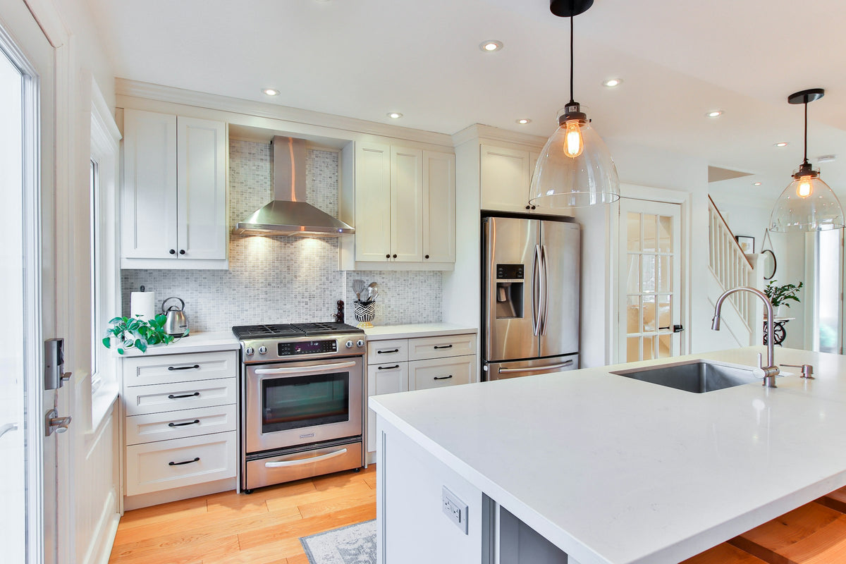 White kitchen cabinets with a white countertop