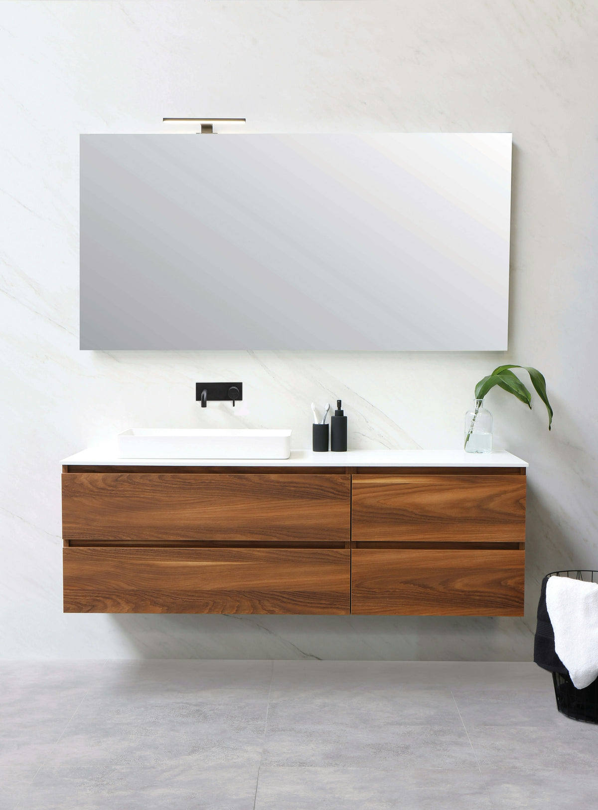 Wood floating vanity with a white sink