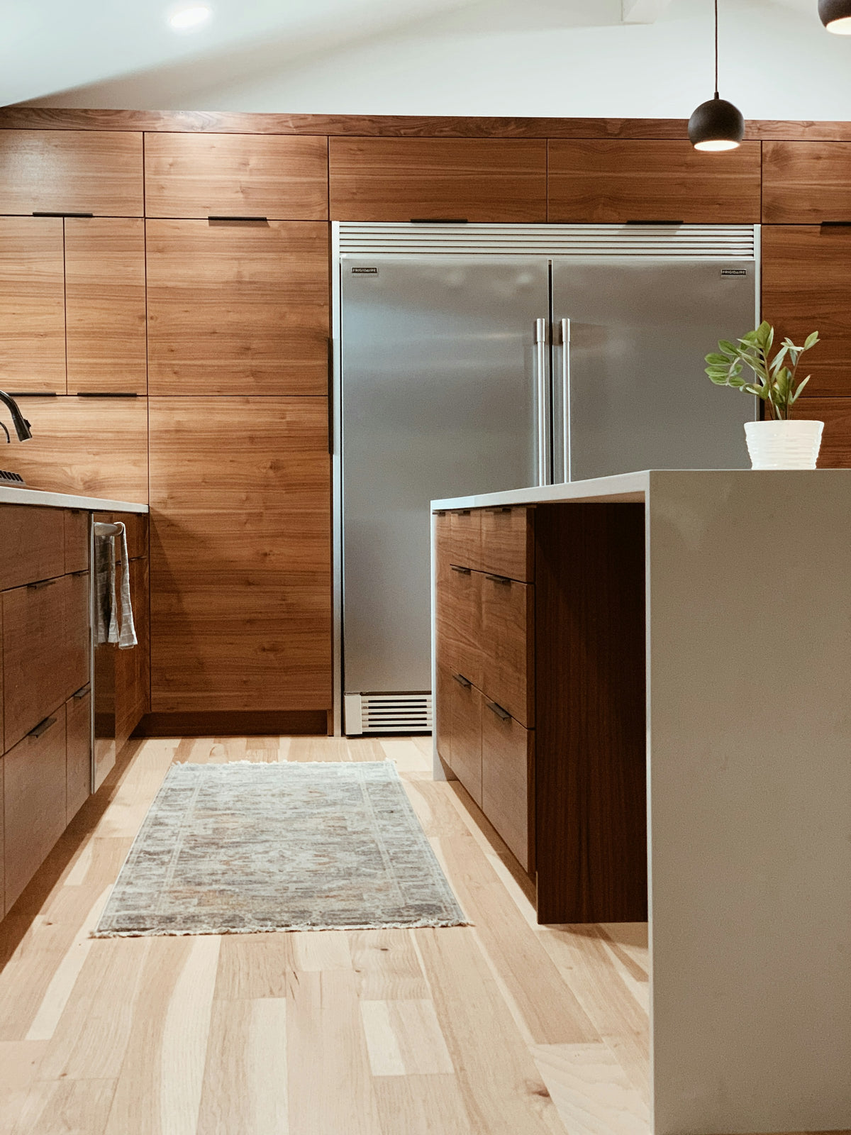 Two-tone brown and white kitchen cabinets