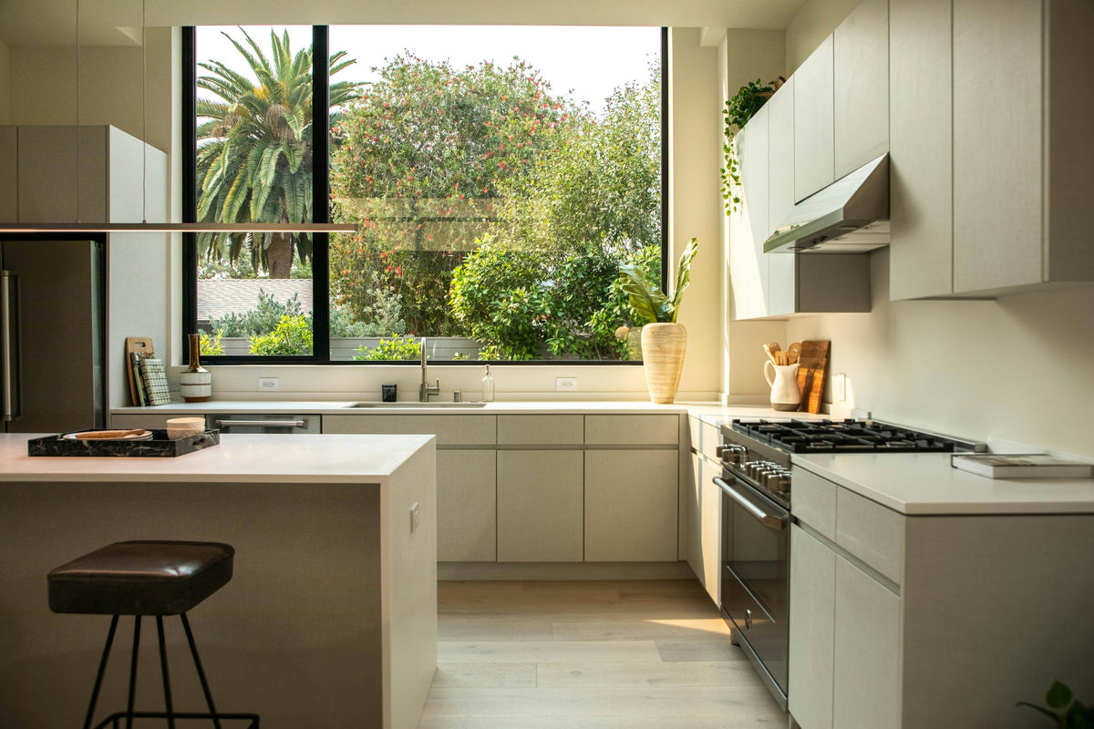 Kitchen with a large island and a tall window