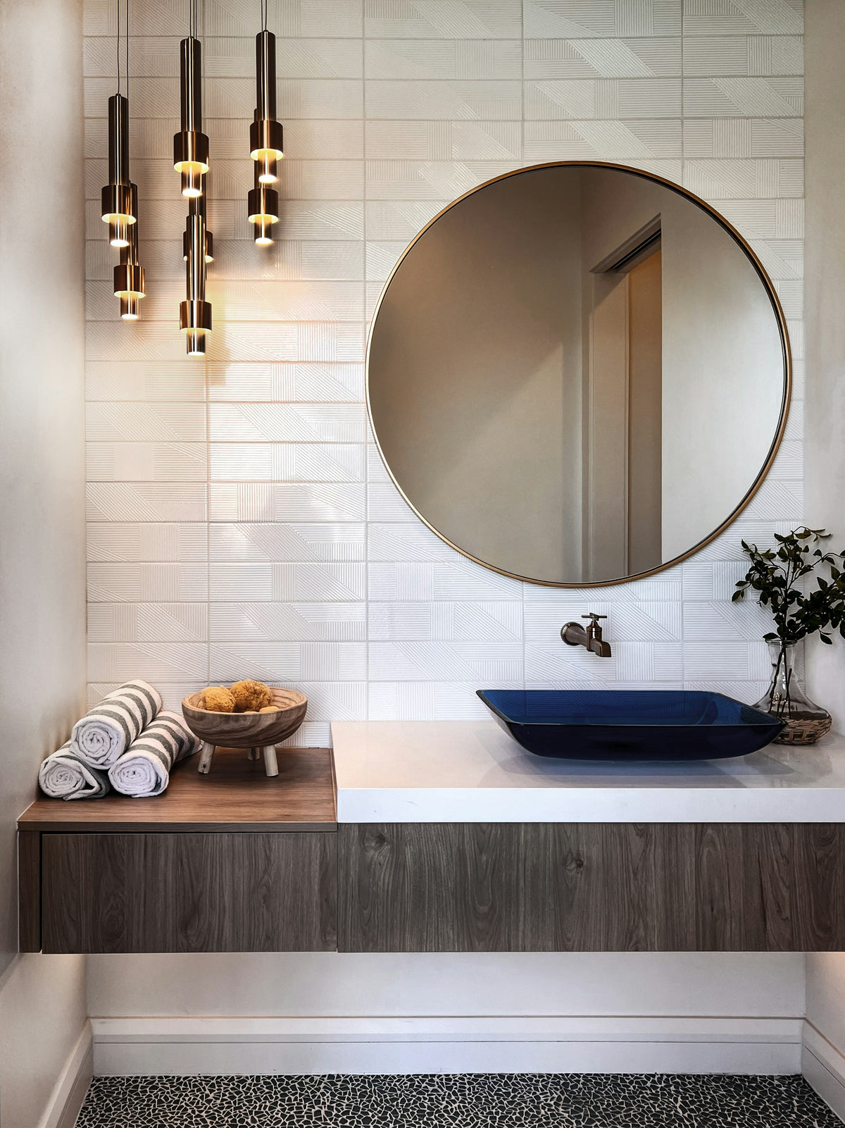 Bathroom vanity with a round mirror