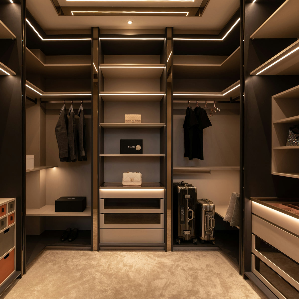 Walk-in closet with shelves and built-in drawers