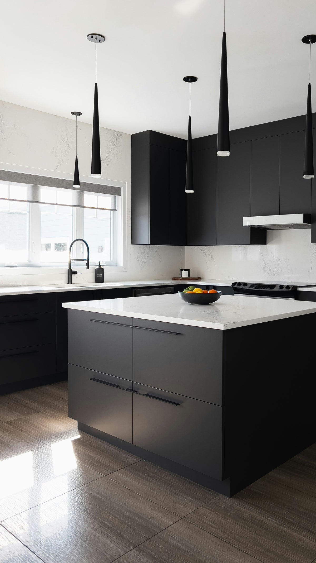 Modern kitchen with black cabinets and white countertops