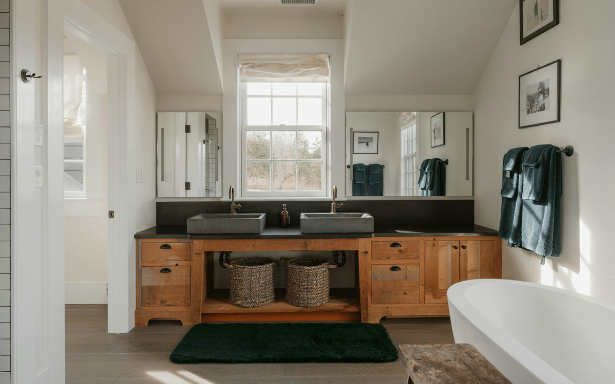 His and hers bathroom vanities with stone finishes